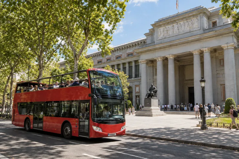 Open-top double-decker hop-on hop-off bus by the Prado Museum in Madrid