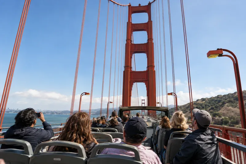 Open-top sightseeing bus crossing the Golden Gate Bridge in San Francisco