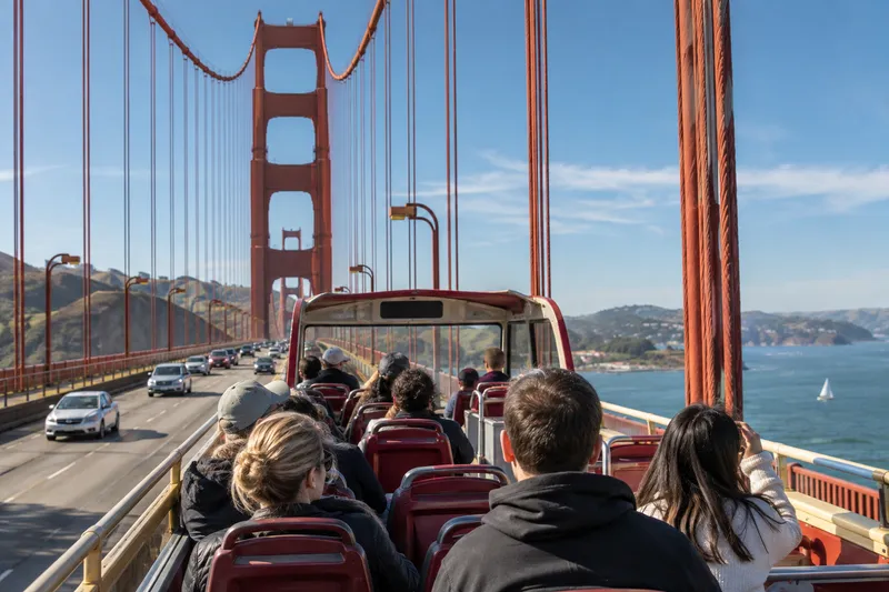 Open-top sightseeing bus crossing the Golden Gate Bridge in San Francisco