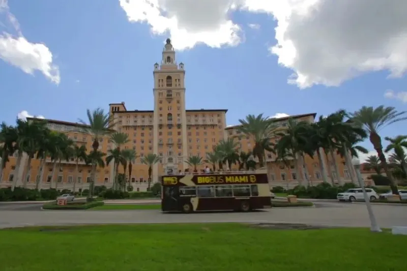 Open-top double-decker Big Bus Miami sightseeing bus on a sunny city street